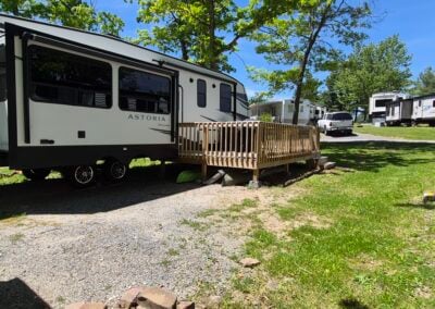 Image of Back Passenger Side of camper shows slideout and deck.