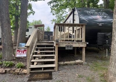 Front of camper and steps leading to deck