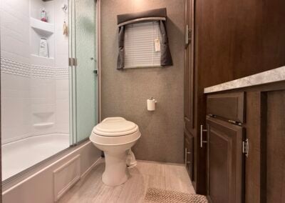 standing shower toilet and sink cabinets