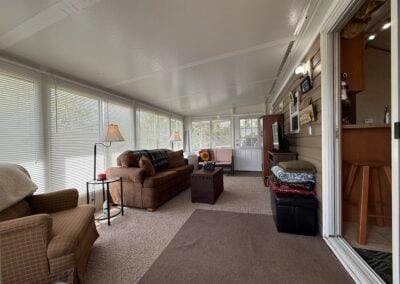 inside of three season room set up like a living room
