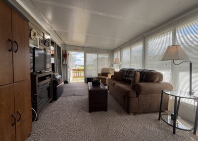inside of three season room set up like a living room