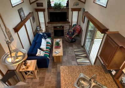 view of living room and kitchen from the loft up- birds eye view