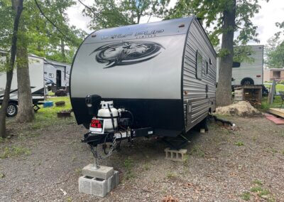 wolf pup driver side exterior of camper gray